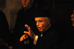 Picture of L. Angelopoulos Chanting and Directing.png